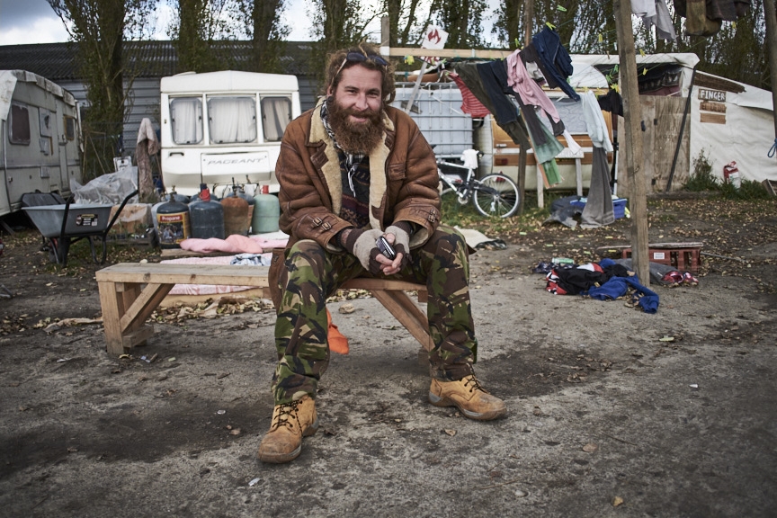French charity worker outside his caravan after a long shift.