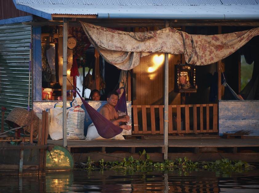 Family sitting in floating home.