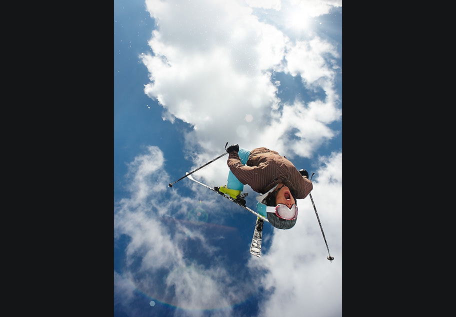 Skier performing mid air back flip