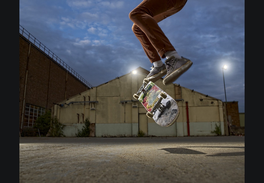 Skateboarder doing kick flip
